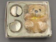 A baby's gift set containing teddy bear,