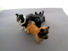 Three Beswick dog figures to include a Cairn Terrier No. 2112, a Sheep dog No.