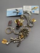 A mixed lot to include costume bracelet and brooch, enamel pin badges,
