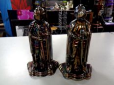 Two antique lustre cast iron Knight companion stands