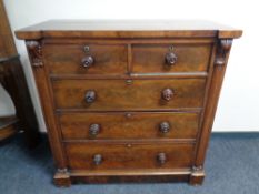 A 19th century mahogany chest of two over three drawers with pillar supports