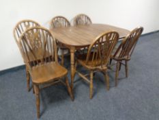 A 20th century Dinette extending dining table together with a set of six Windsor dining chairs