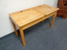 A 20th century double school desk bearing the names Charlotte and Jessica