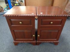 A pair of reproduction mahogany bedside cabinets fitted a drawer