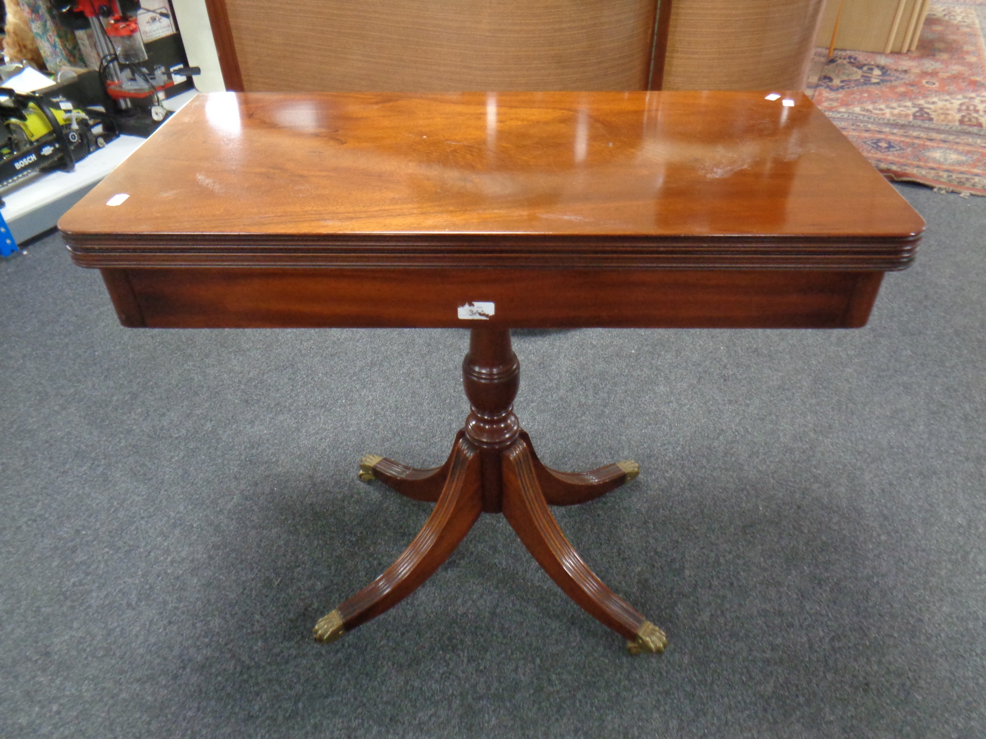 A Victorian style mahogany turnover top pedestal card table on brass capped feet - Image 2 of 2