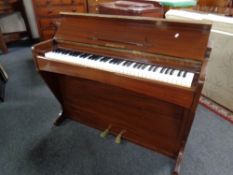 A mahogany cased mini piano by Consolette