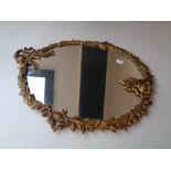 A decorative gilt metal framed mirror together with two cut glass lidded trinket pots and two cut