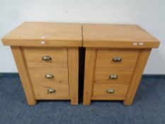 A pair of contemporary pine three drawer bedside chests