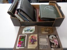 A box of nine albums of antique and later postcards including anniversaries,