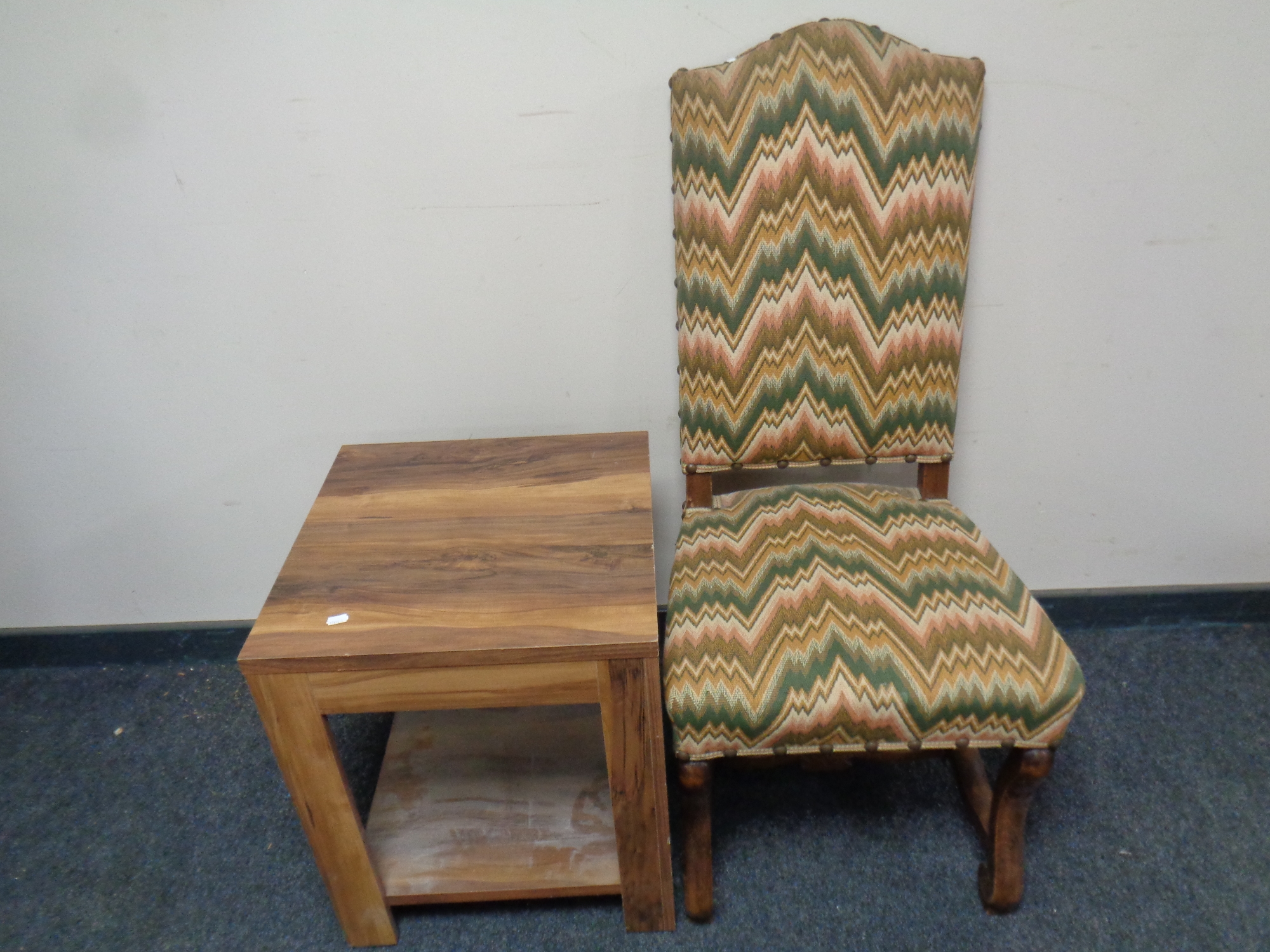 A continental beech framed high back chair upholstered in a tapestry fabric,