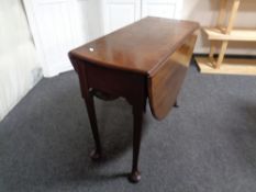 A late 19th century mahogany gateleg table on club feet