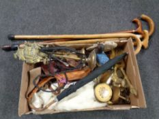 A box of miscellany to include leather holsters, walking stick, brass ware, dressing table set,