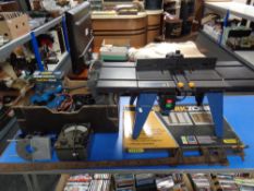 A Powercraft router table together with a box containing power tools, Bakelite cased avometer,