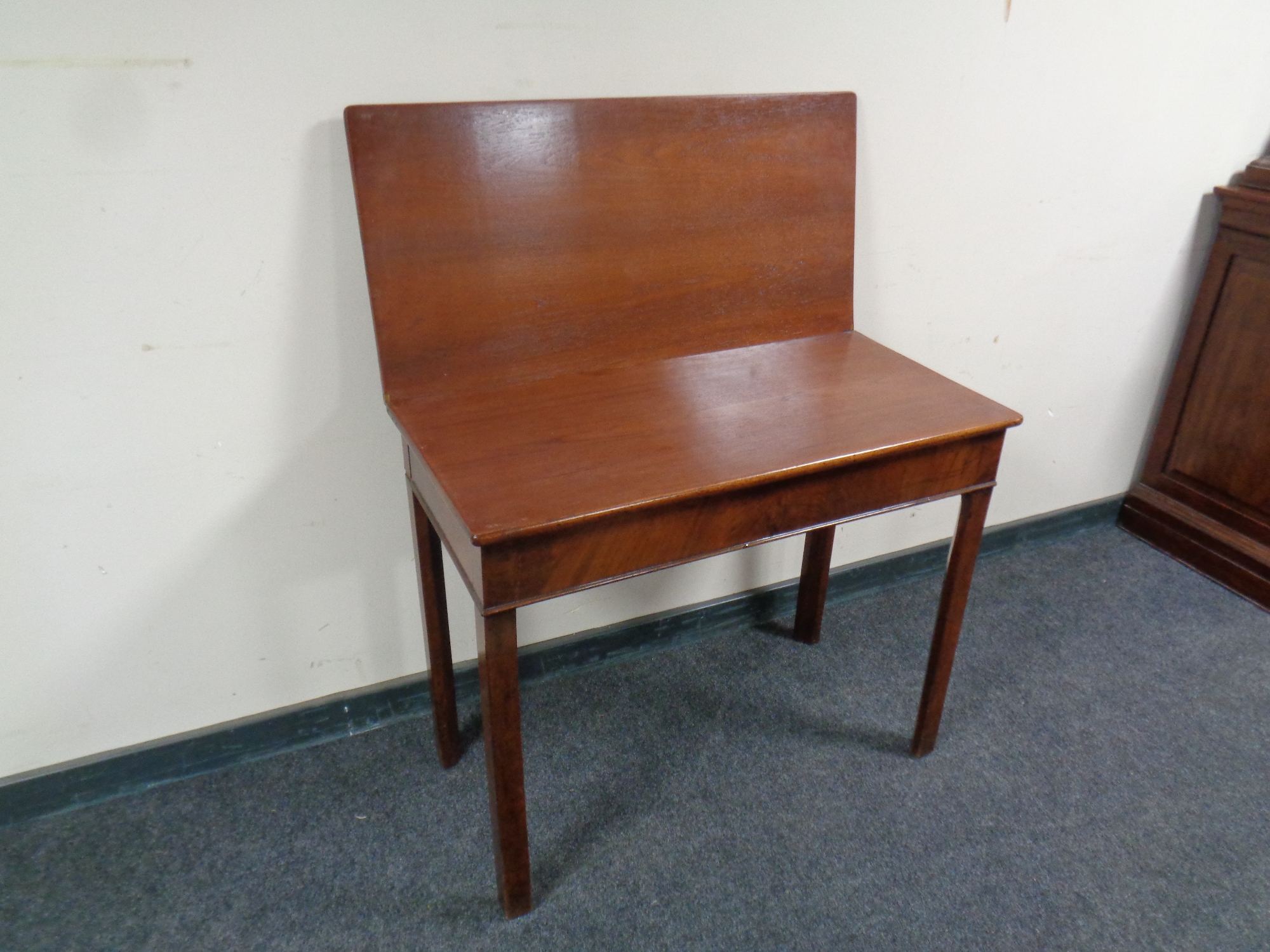 A 19th century mahogany turnover top tea table