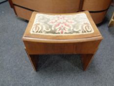 A 20th century walnut sewing box/stool upholstered in a brocade fabric