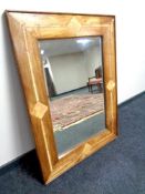 A Barker & Stonehouse wood framed an inlaid bevelled wall mirror