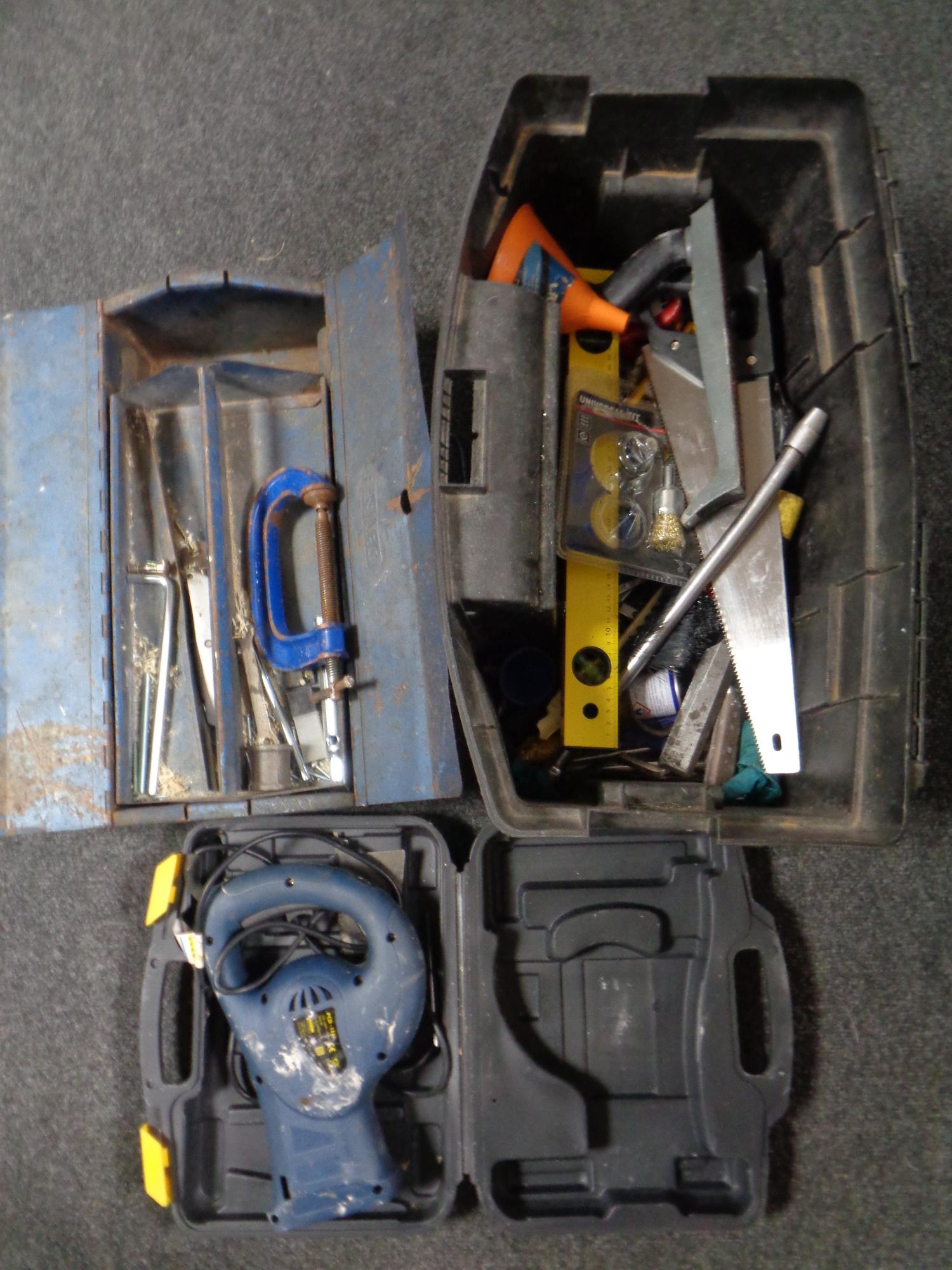 A crate of assorted hand tools, spirit level, cased reciprocating saw,