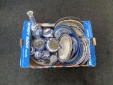 A box containing antique and later blue and white ware to include meat plates, dinner plates,