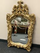 A reproduction ornate mirror,