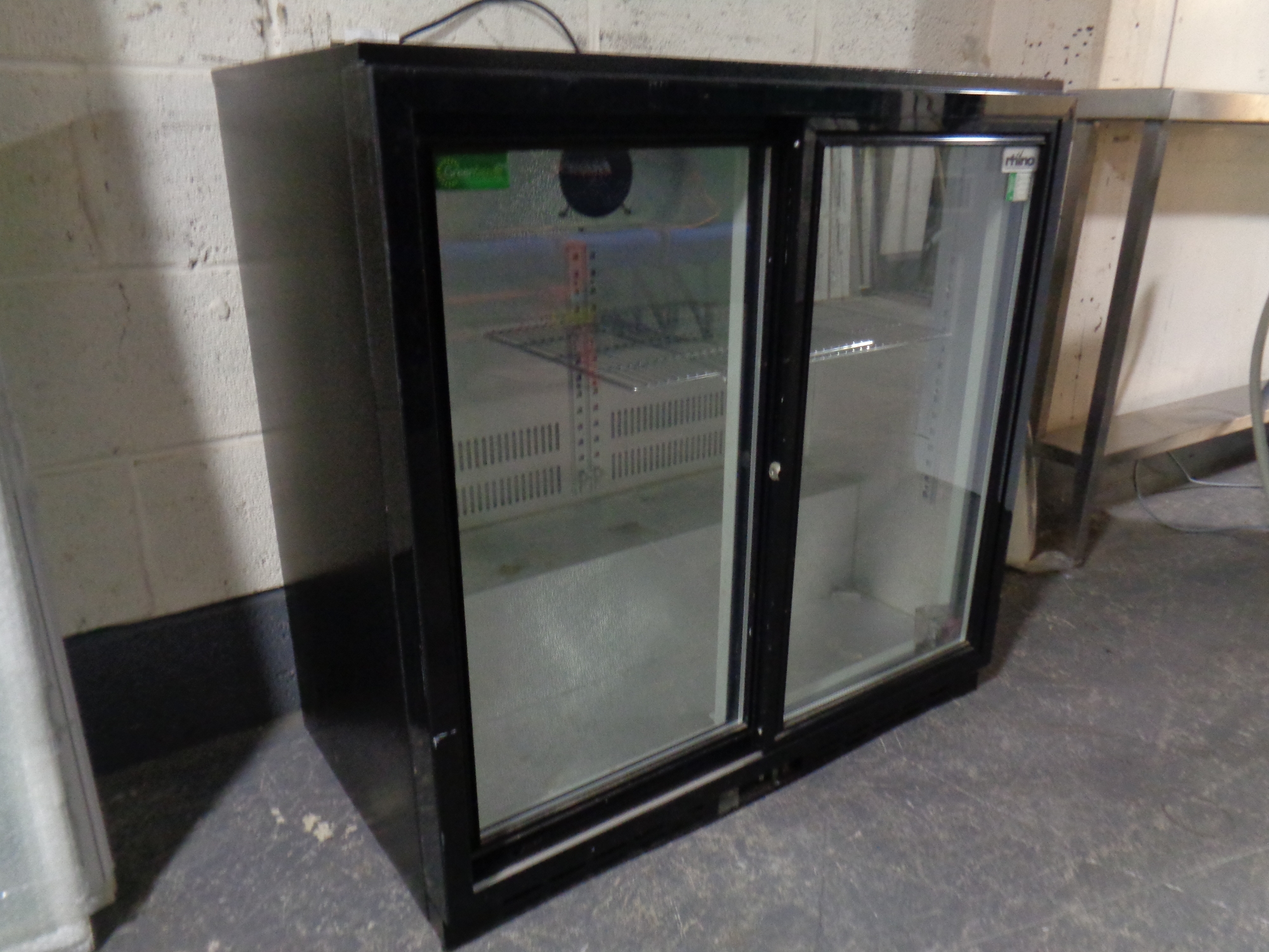 A Rhino double door glass fronted under bench bottle chiller