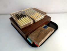 A tray containing an oak canteen of chrome plate cutlery,