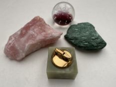 Two pieces of rock crystal together with an onyx table lighter and a paperweight