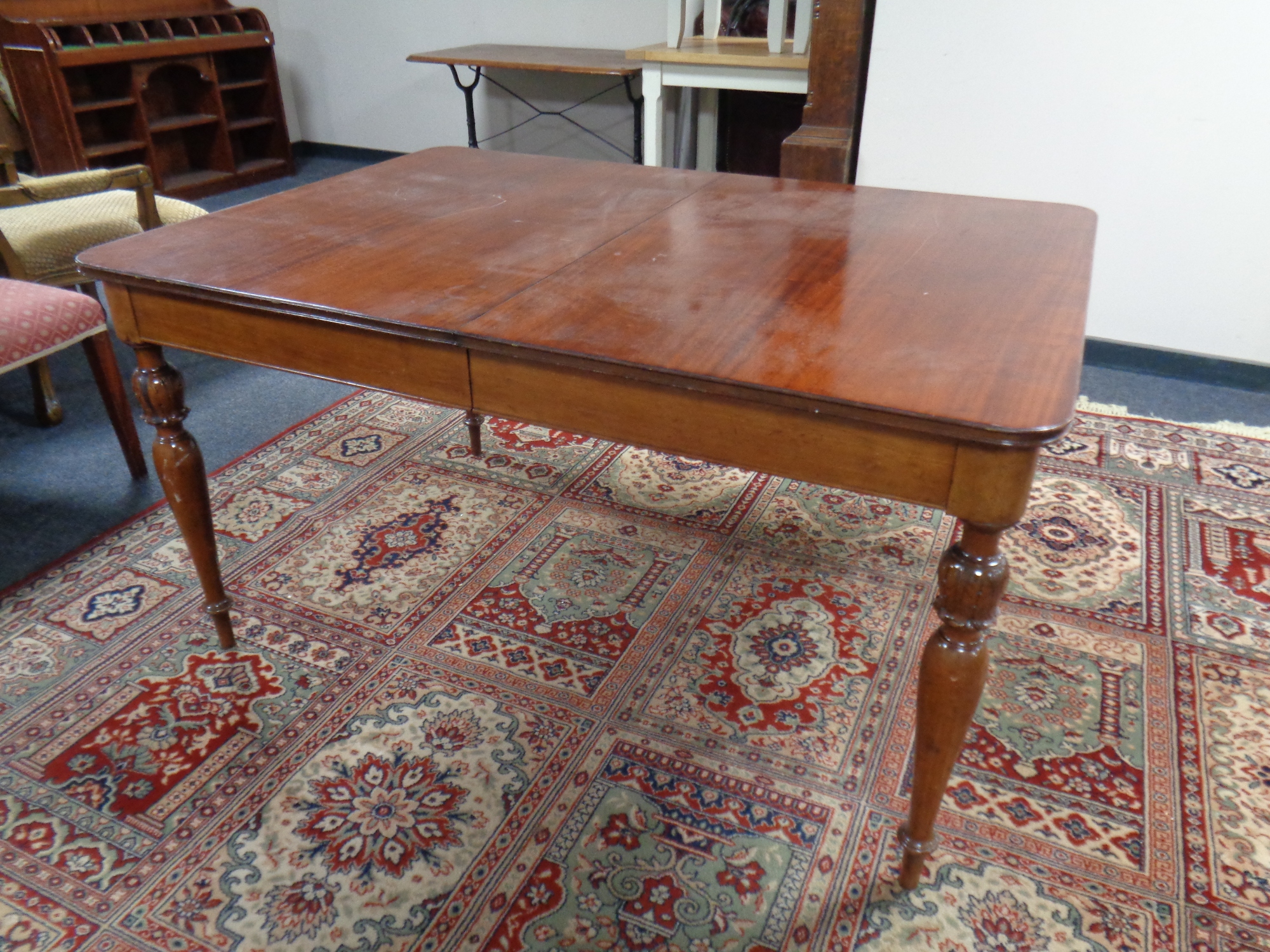 A 19th century mahogany and beech extending dining table