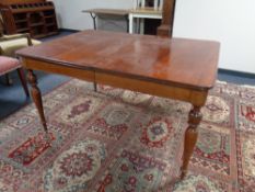 A 19th century mahogany and beech extending dining table