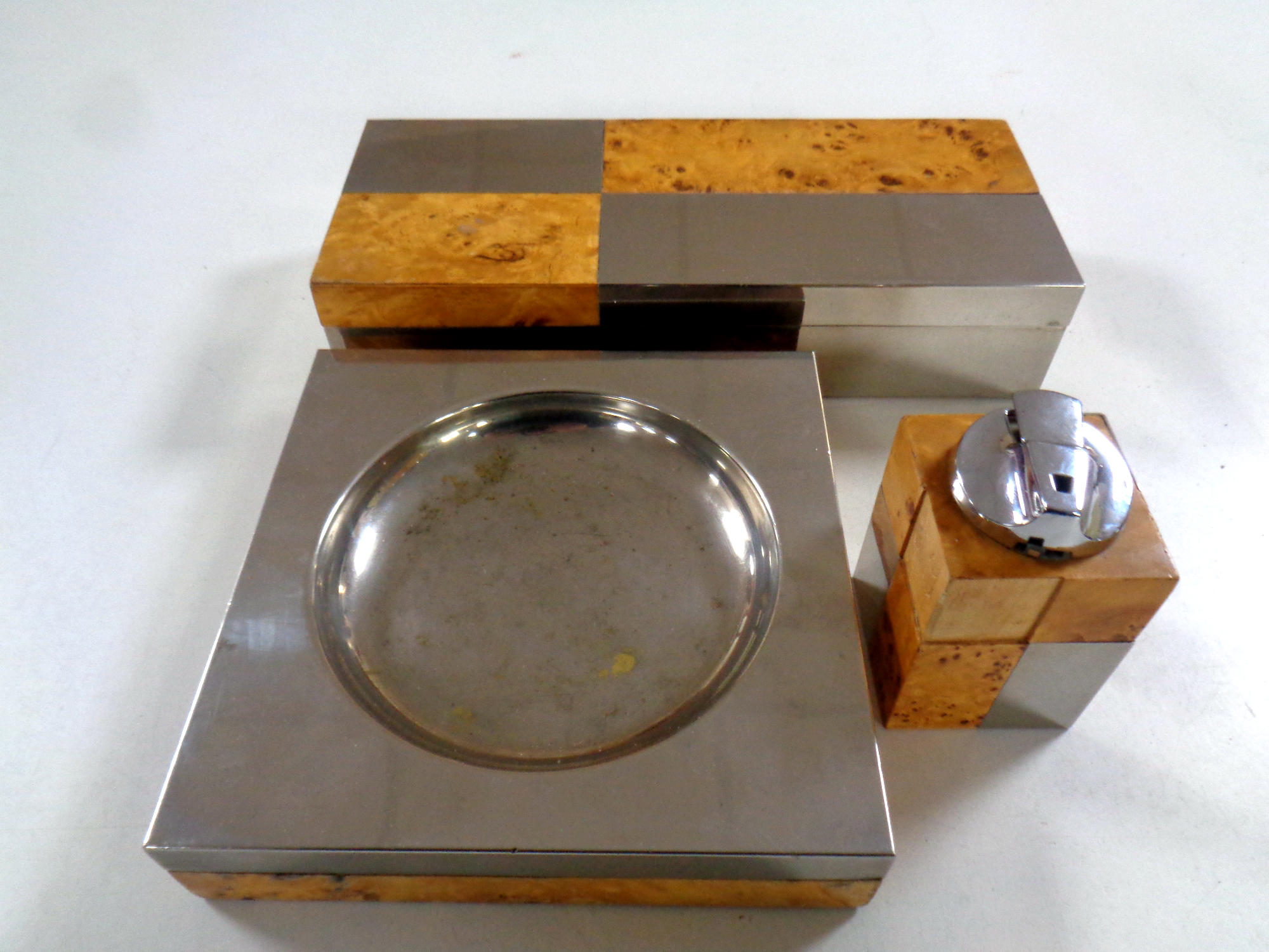 An art Deco walnut and chrome cigarette box together with matching table lighter and ashtray