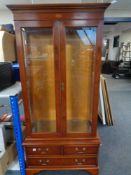 A Bradley Furniture inlaid yew wood double door display cabinet fitted three drawers beneath