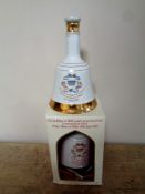 A Bell's Scotch Whisky decanter by Wade to commemorate The Birth of Prince Henry of Wales 1984,