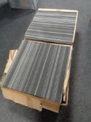 Four boxes containing grey striped carpet tiles,
