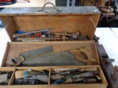 A vintage joiner's toolbox containing a large quantity of woodworking tools to include planes,