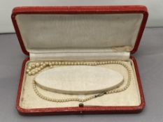 A vintage pearl necklace in box