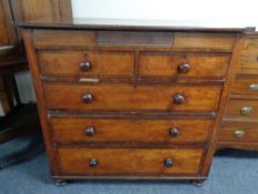 A Victorian mahogany chest of two over three drawers with secret drawer above