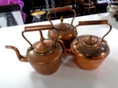 Three antique copper kettles