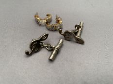 A pair of silver gilt stone set earrings together with a pair of treble clef cuff links