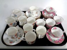 A tray of sixteen pieces of Royal Doulton Madrigal coffee ware and five Royal Standard Rose of