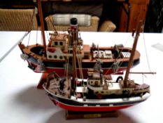 Two wooden models of fishing trawlers