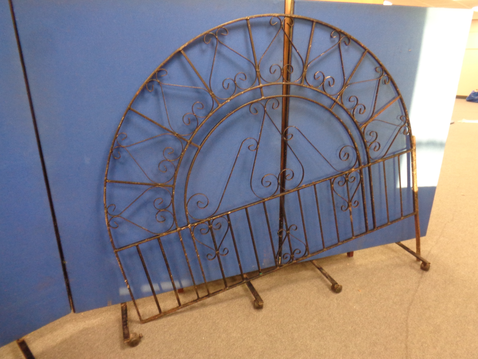 An arched wrought iron panel