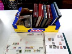 Eleven albums and books containing a large quantity of 20th century stamps of the world together
