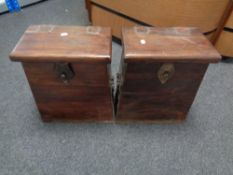 A pair of eastern sheesham wood storage boxes with metal handles and fittings