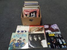 A box of a large quantity of vinyl LP's to include many albums by The Beatles, The Rolling Stones,