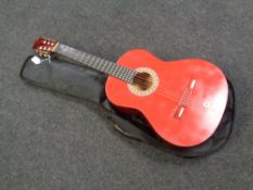 An Encore ENC 44 acoustic guitar in carry bag