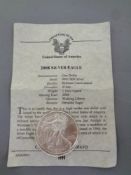 An American 2008 uncirculated silver dollar with certificate