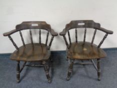 A pair of early 20th century beech elbow chairs