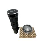 A Nikon lens : Zoom-Nikkor 50~300mm 1:45, numbered 780586.