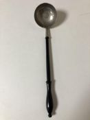 A toddy ladle with inset coin