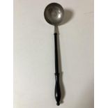 A toddy ladle with inset coin