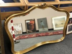 A reproduction bevelled overmantel mirror,